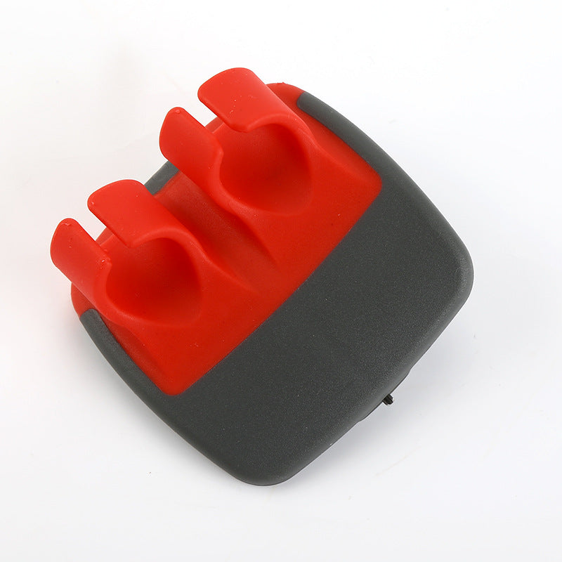 Red palm vegetable peeler on white background