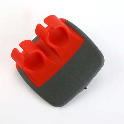 Red palm vegetable peeler on white background