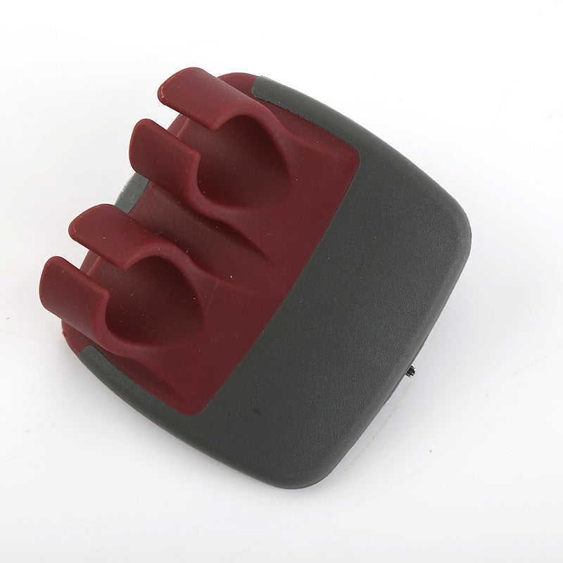 Wine red palm vegetable peeler on white background