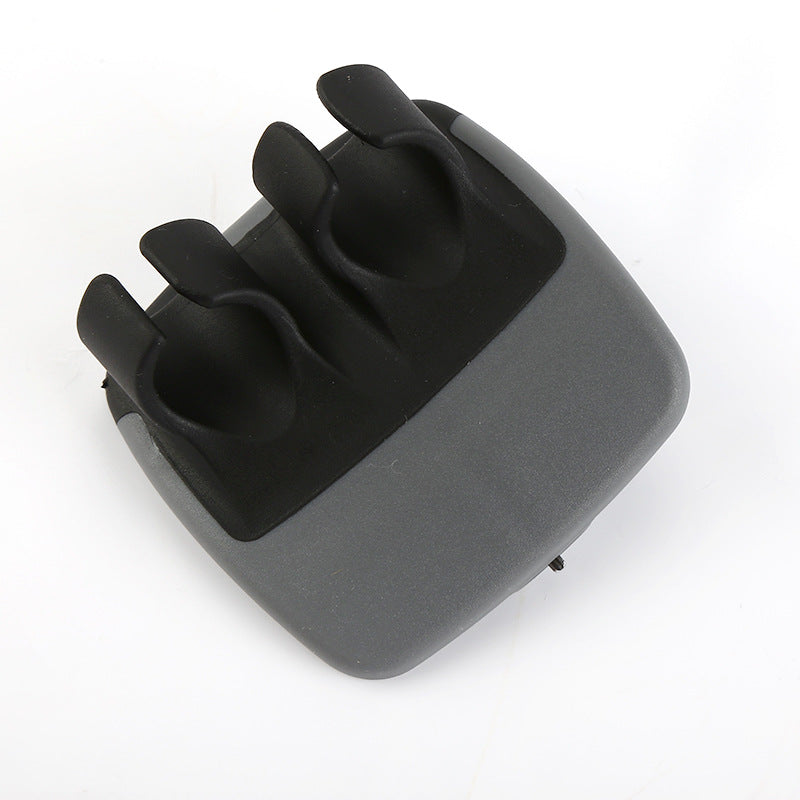 Black palm vegetable peeler on white background