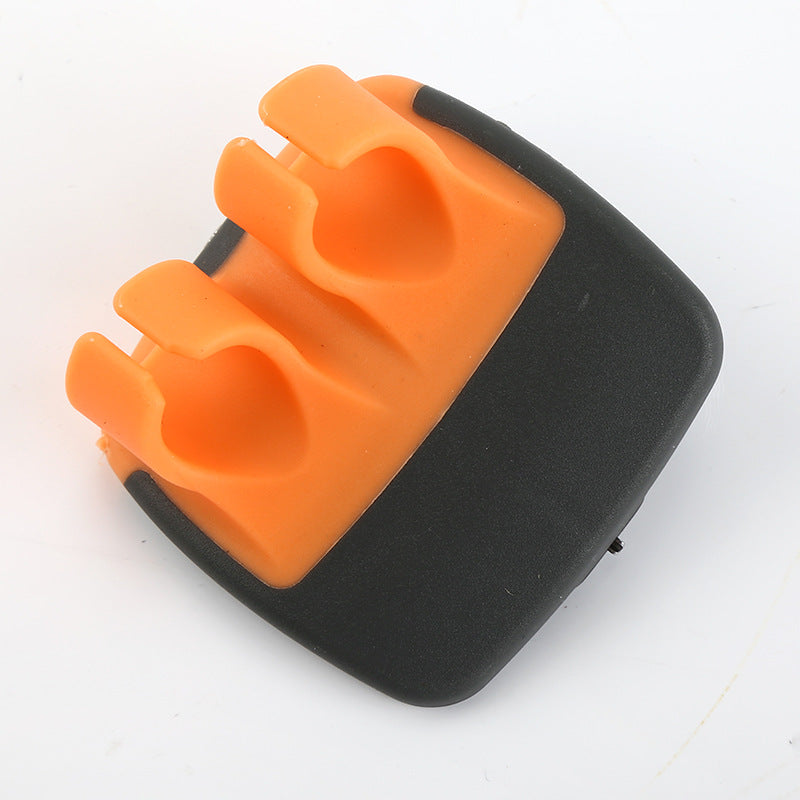 Orange palm vegetable peeler on white background